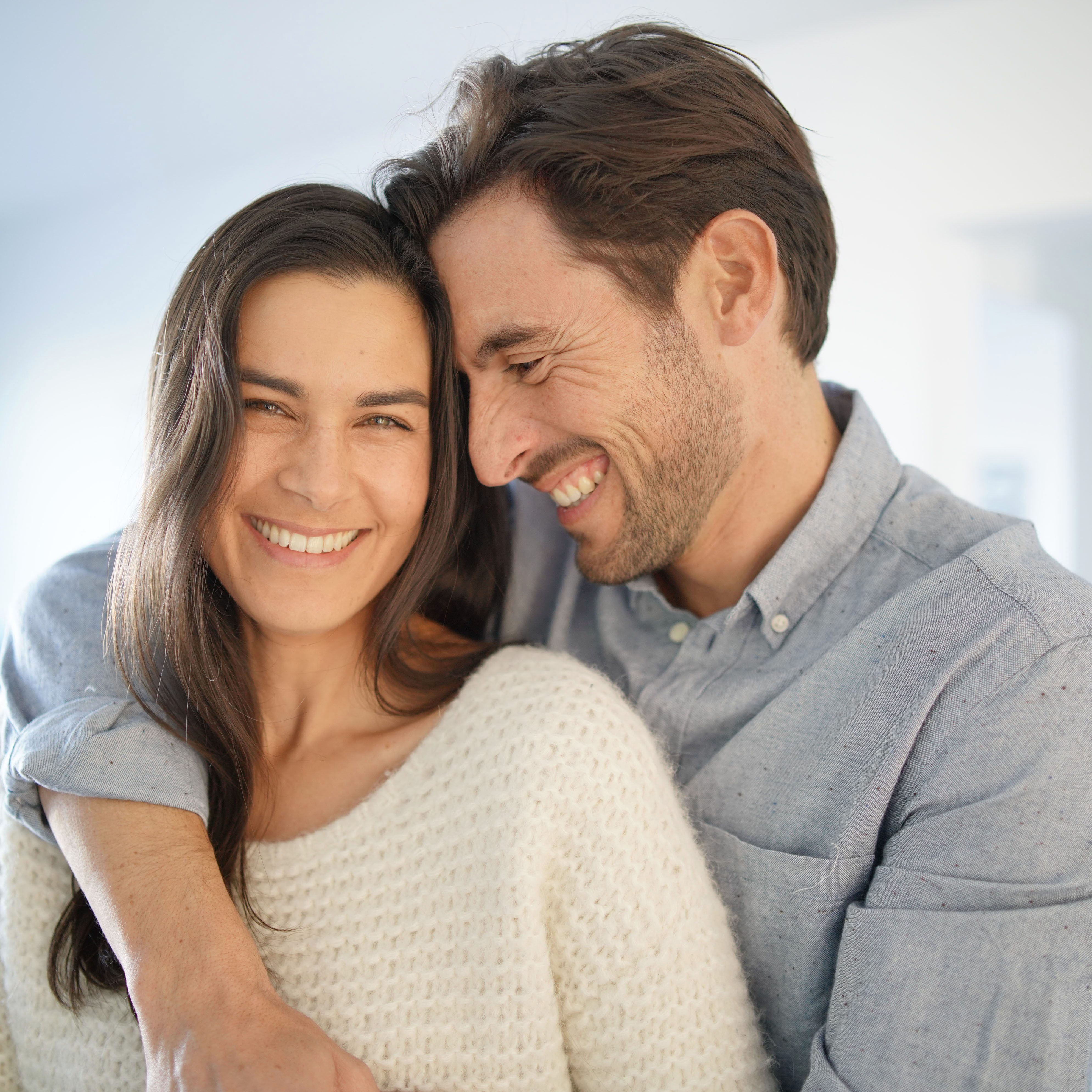 Portrait of handsome couple in modern house